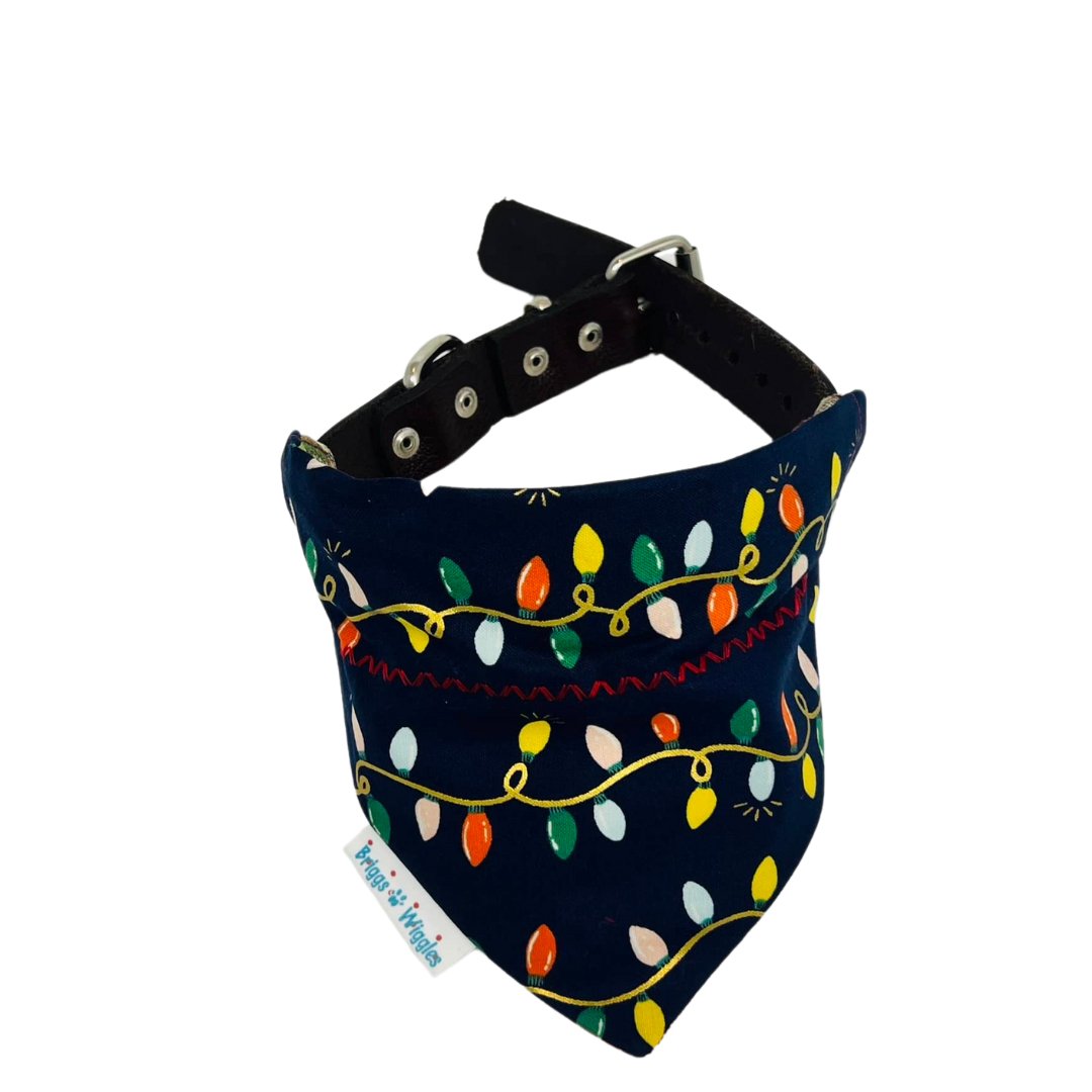 Handmade Rifle Paper Co. Christmas lights dog bandana with metallic gold accents – festive reversible holiday pet accessory by Briggs ‘n’ Wiggles.