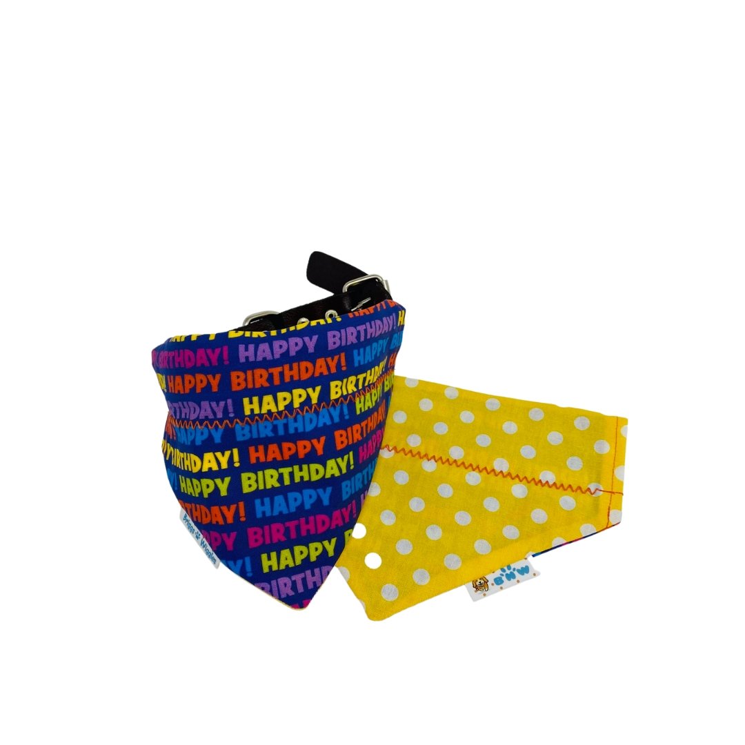 Reversible Happy Birthday dog bandana with a bright cobalt blue front featuring colorful 'Happy Birthday' text and festive back design, perfect for celebrations.