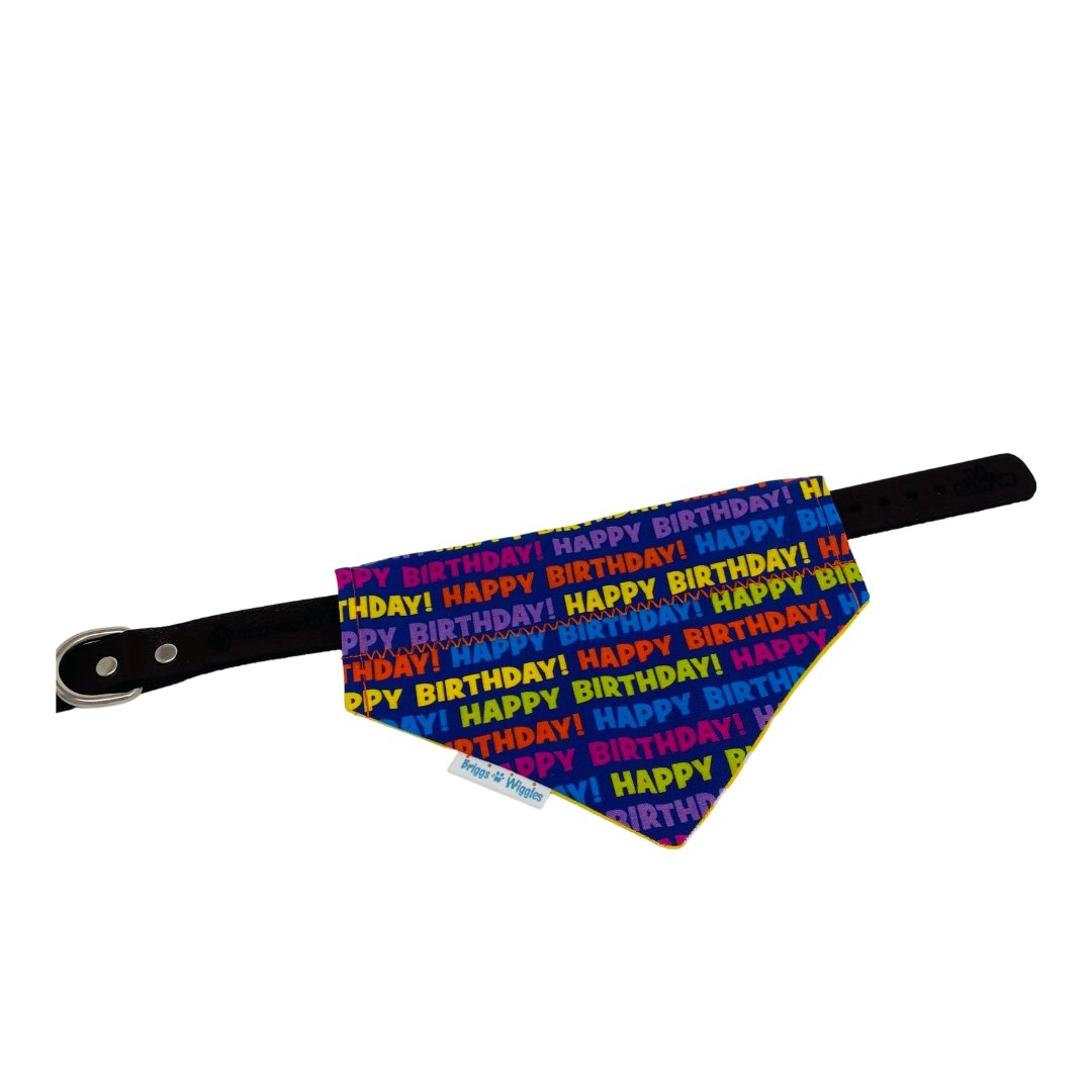 Happy Birthday Dog Bandana laid flat, showcasing its bright cobalt blue background and cheerful design, made fr pet celebrations and photo worthy moments.