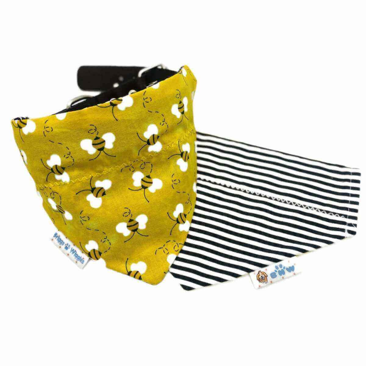 Reversible dog bandana with a yellow background and floating bees on the front, and a black-and-white stripe print on the back, perfect for everyday where