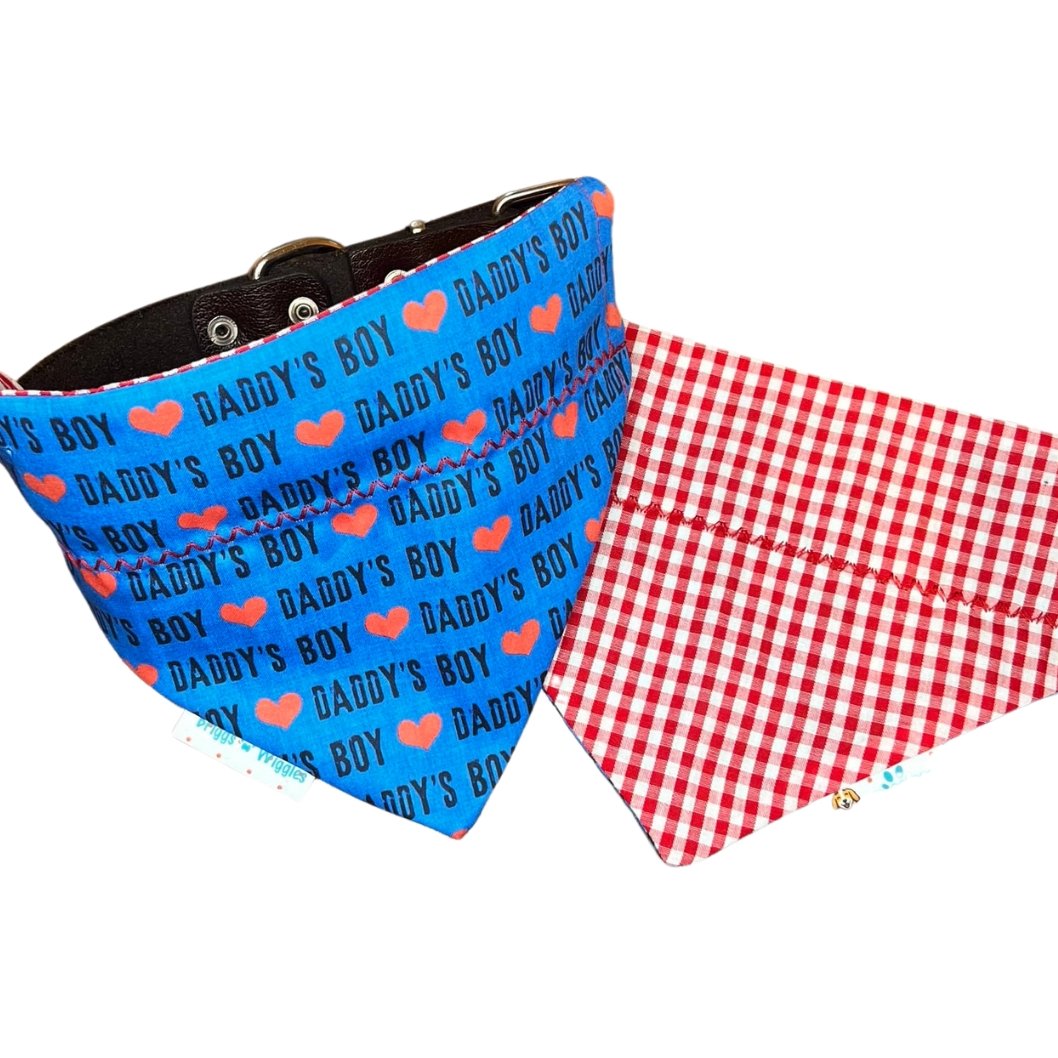 Blue Daddy's Boy reversible dog bandana showing the front with 'Daddy's Boy' text with red heart and a stylish reverse design, perfect for fashionable pets.