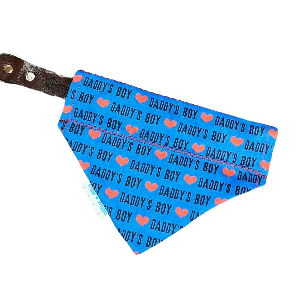 Blue Daddy's Boy reversible dog bandana displayed on a collar, featuring bold text on one side and a versatile design for everyday wear!