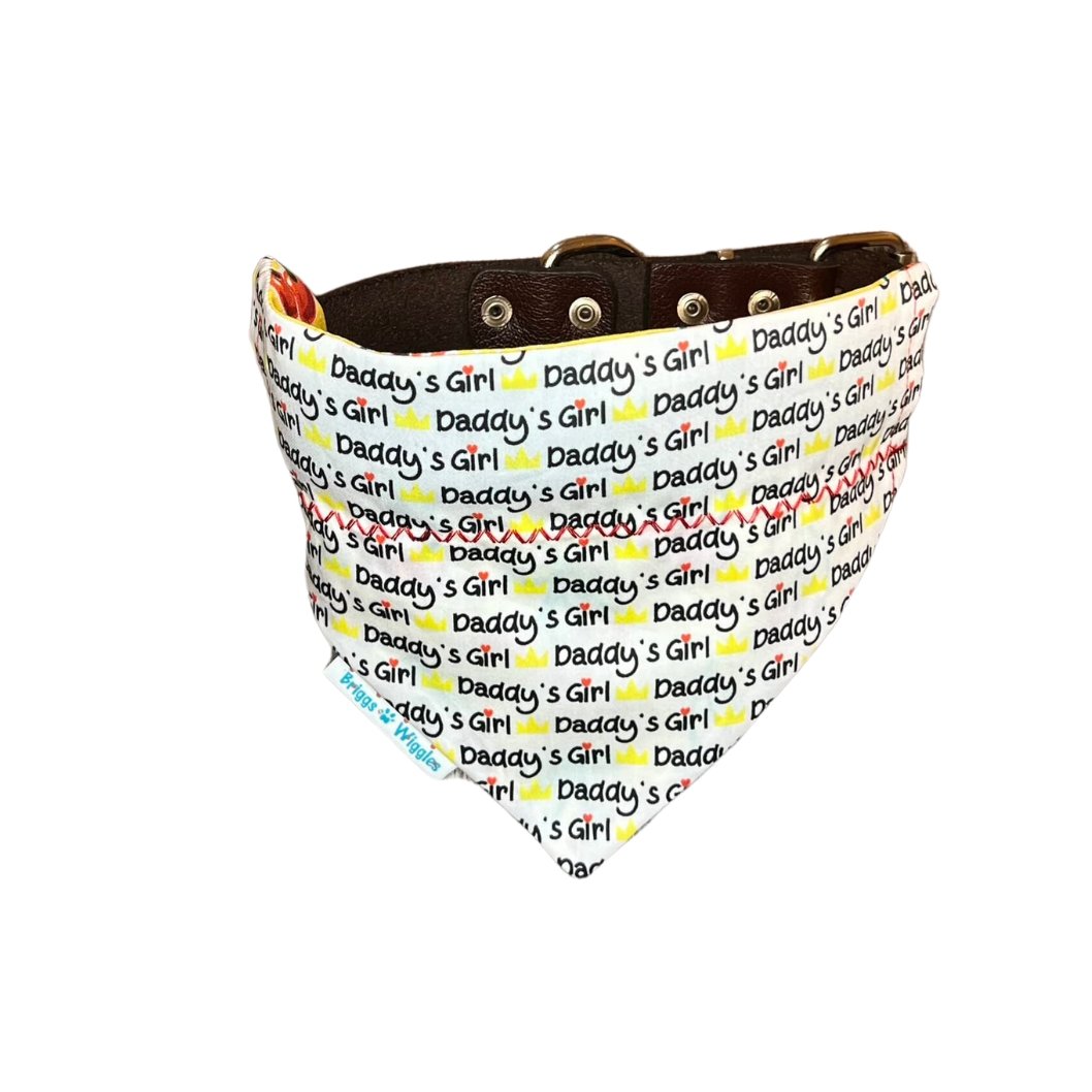 Daddy's Girl Dog Bandana featuring a white background with bold yellow and black text and a red heart design for fashionable pups.