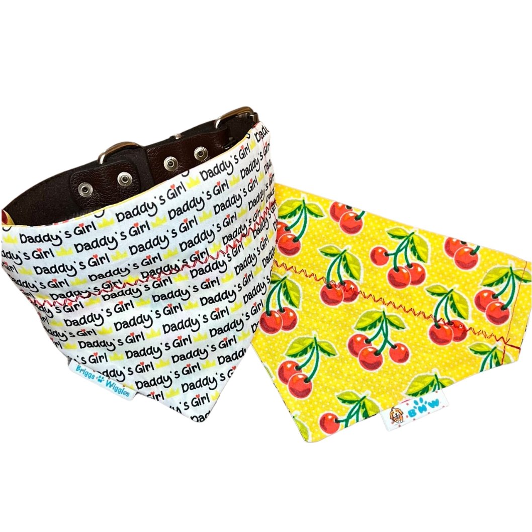 Daddy's Girl reversible dog bandana showing front with white background, yellow and black text and red heart detail, plus a versatile reversible side.