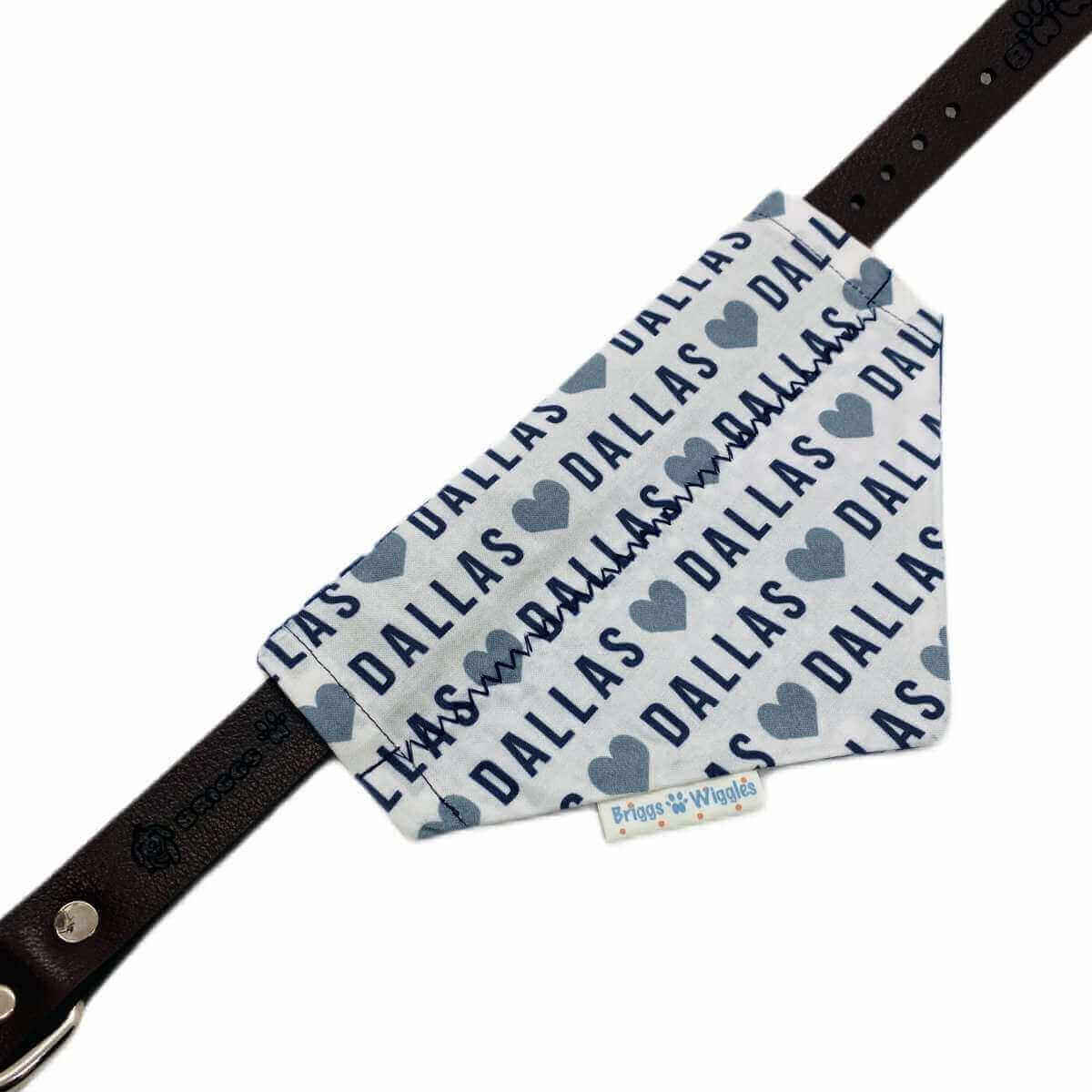 Flat lay of the 'I Love Dallas Bandana', showcasing the bold front design with Dallas -inspired colors shown on the collar.