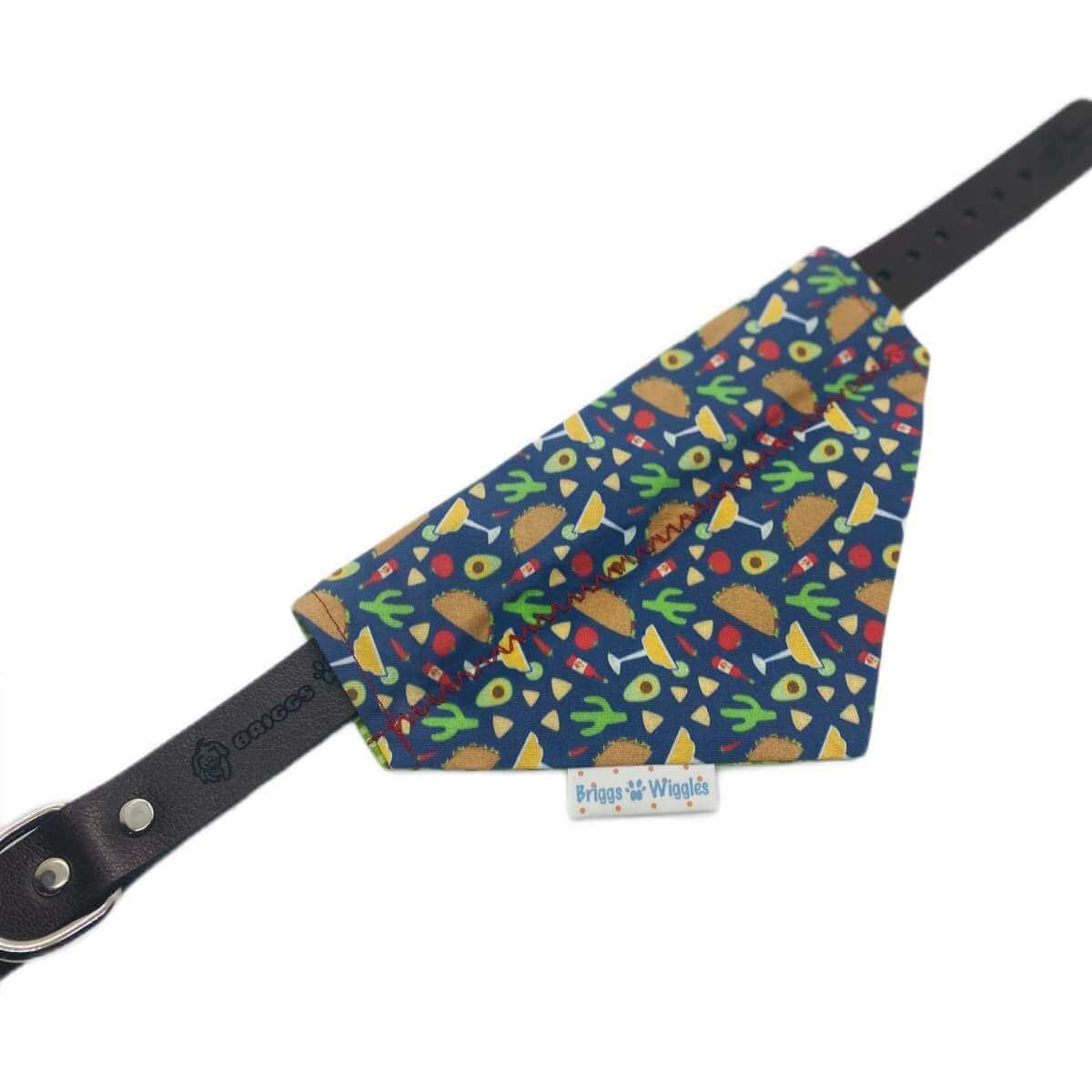 Flat lay of handmade dog bandana showing front side with tacos and margaritas print, perfect for Taco Tuesday.