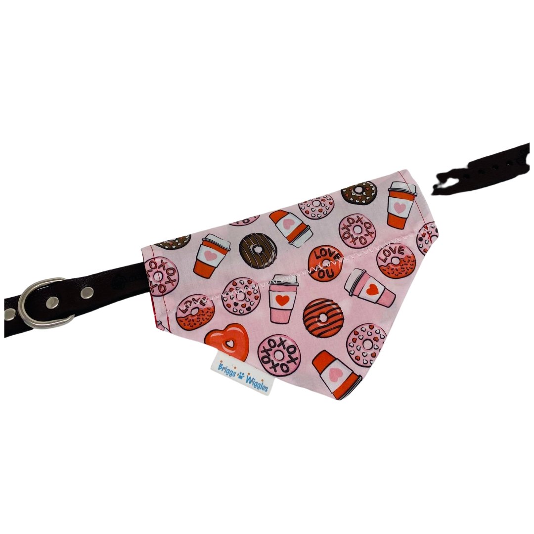 Valentine's Coffee & Donuts dog bandana laid flat, showcasing floating coffee cups and donuts on a pink background for a fun holiday-inspired look.