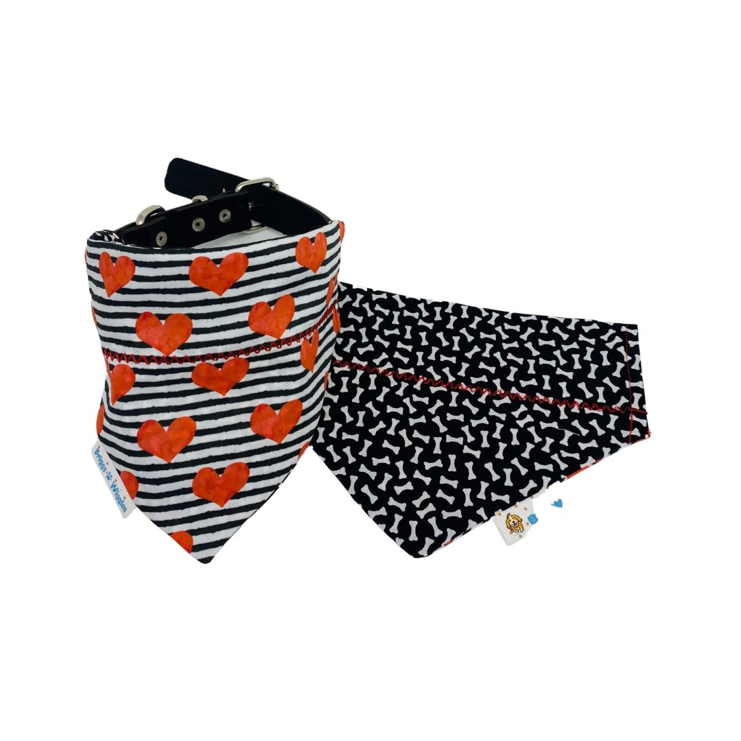 Black-and-white striped Valentine's Day dog bandana with a bold red heart on the front and a reversible design for stylish pet wear.