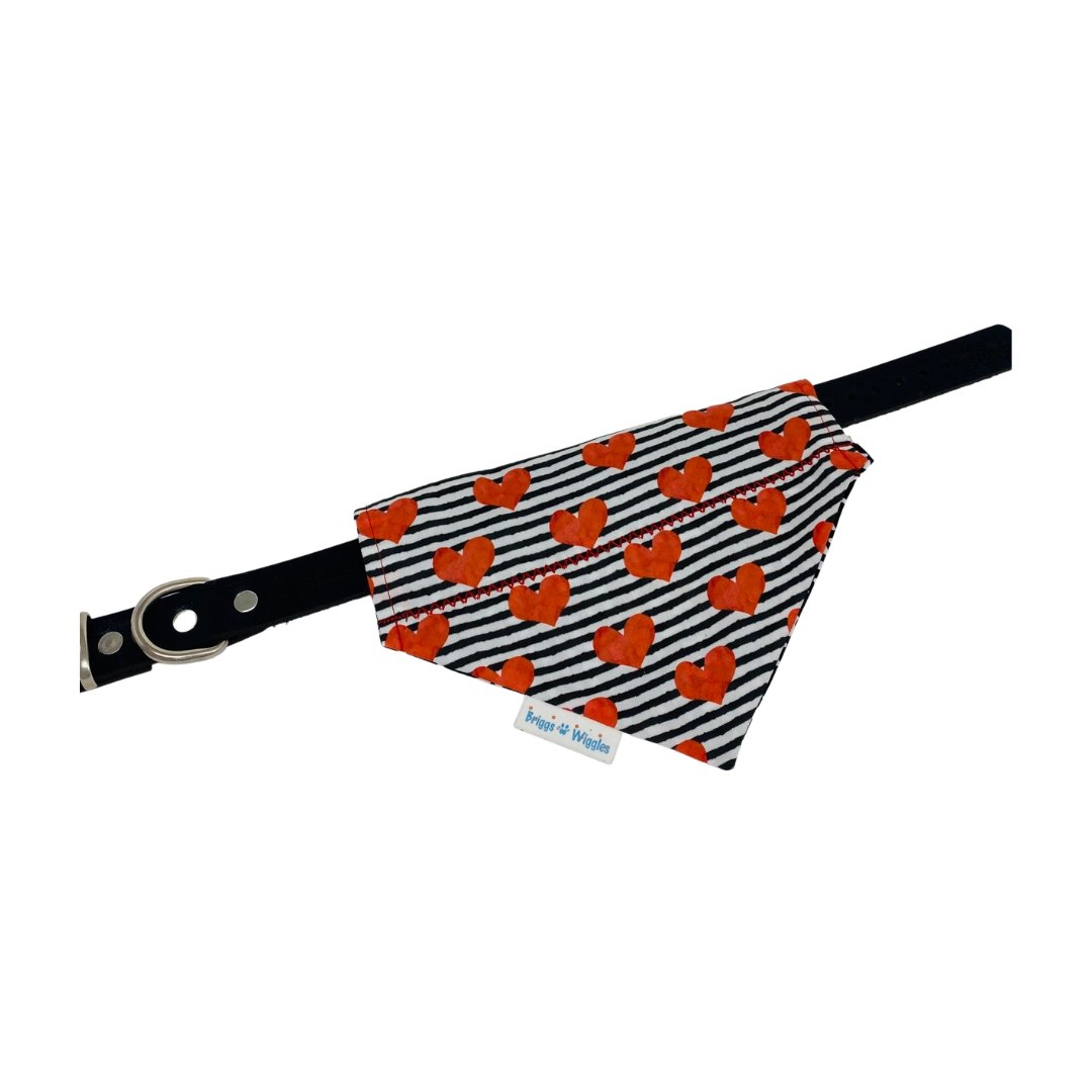 Black-and-white striped Valentine's Day Bandana displayed on a collar, showcasing a red heart design for chic and functional pet fashion.