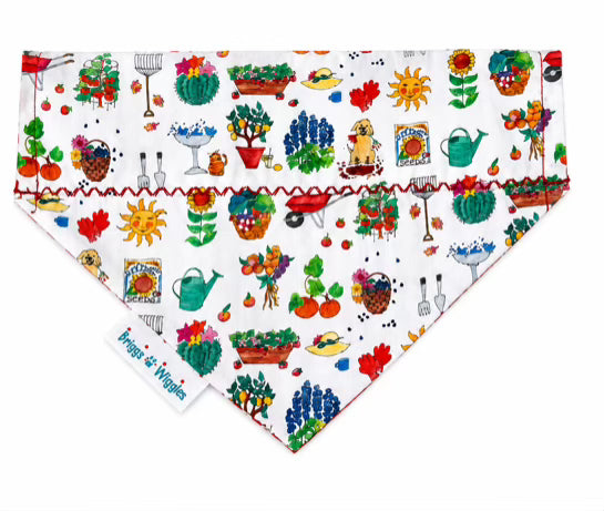 Everything Spring Garden Dog Bandana featuring colorful flowers, watering cans, vegetables, sunshine, and gardening illustrations on a white background by Briggs 'n' Wiggles.