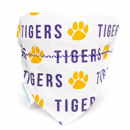 A white pet bandana featuring purple 'TIGERS' text and yellow paw prints, with a small blue 'Long Haul Pet Supplies' tag on the side, shown against a plain white background.